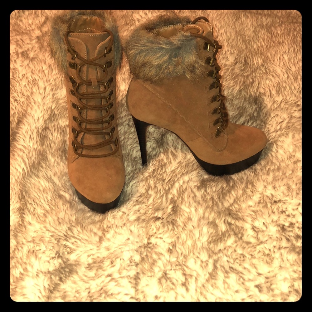 Brand new High heel short fur boots.